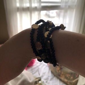 Set of 5 stretchy navy and gold beaded bracelets.